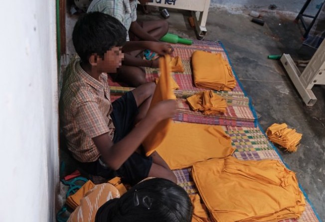 Suma, 14, Mukul, 12, and Manik, 13, work on manufacturing T-shirts at a micro garment enterprise in Tiruppur. Photo: Shamsheer Yousaf