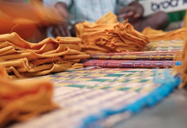 Manik, 13, works at a small garment enterprise manufacturing T-shirts in Tiruppur. Photo: Shamsheer Yousaf