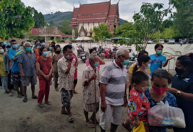 People line up for a Life Bag at a temple.