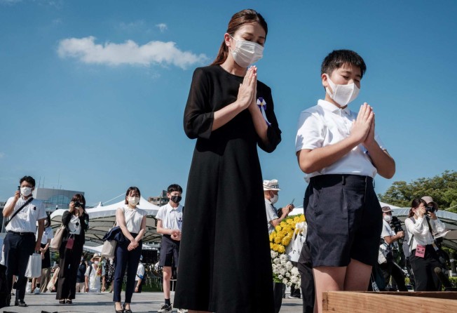 People pray at the Hiroshima Peace Memorial Park at an annual ceremony to remember the victims of the world’s first atomic bomb attack. Japan’s new leader Fumio Kishida was brought up in Hiroshima. Photo: AFP