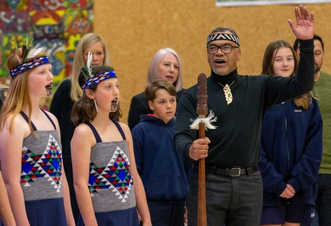 Children learn about Māori culture at a primary school in Queenstown, New Zealand, in May. Photo: Getty Images