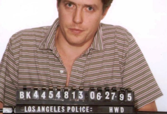 British actor Hugh Grant in the LA Police mugshot taken after he was found in a car committing a ‘lewd act’ with the prostitute Divine Brown. Photo: AP