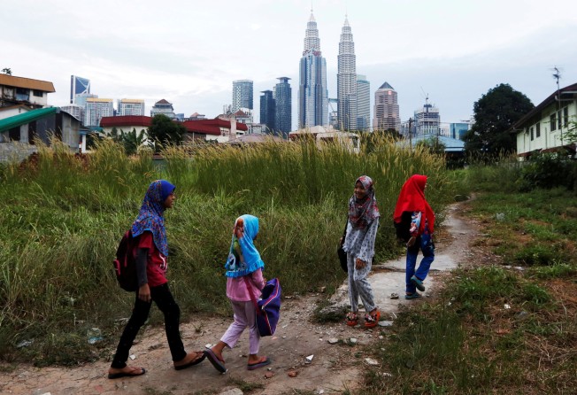 Children make their way home from school in Kuala Lumpur. File photo: Reuters