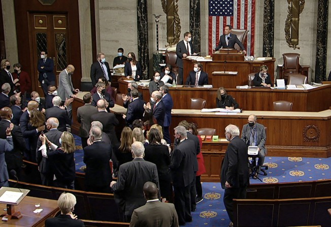 Democrats celebrate on the House floor on November 5 after winning hard-fought approval for a US$1.2 trillion package of infrastructure projects. Photo: House Television via AP