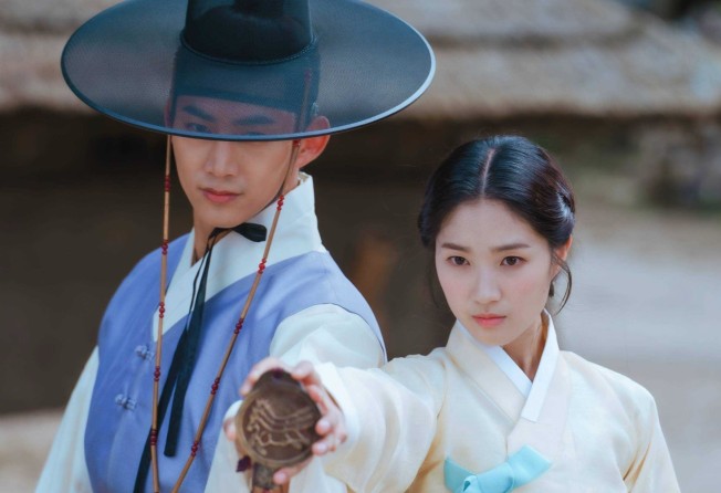 Ok Taecyeon (left) and Kim in a still from Secret Royal Inspector & Joy.