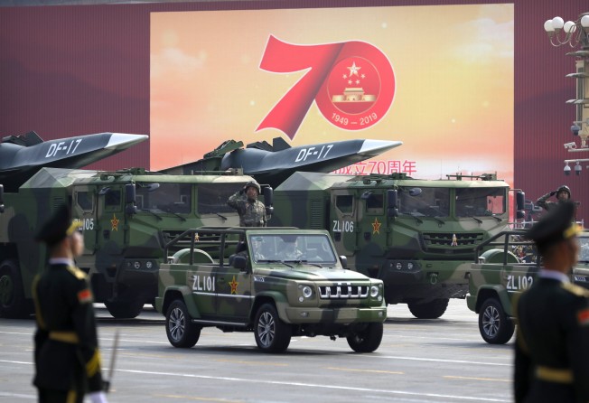 Chinese military vehicles carrying DF-17 ballistic missiles roll during a parade in Beijing in October 2019. Photo: AP