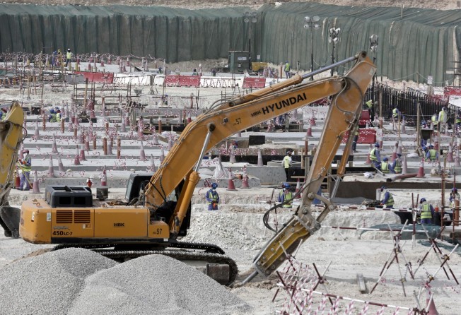 Workers use heavy machinery in this 2015 photo as the Al-Wakra Stadium was being built for the 2022 World Cup in Qatar. Photo: AP