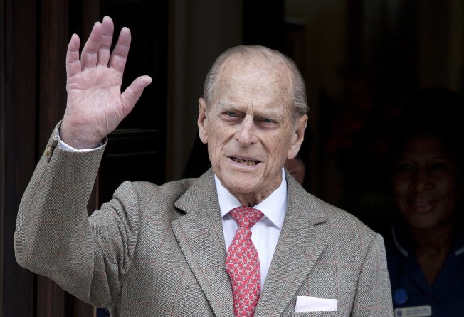 Prince Philip, the Duke of Edinburgh waves as he is discharged from the King Edward VII hospital in central London, Britain, in June 2012. Photo: EPA-EFE