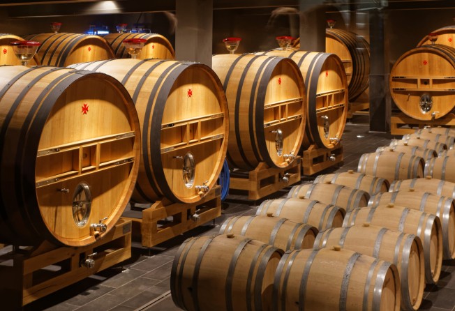 Oak barrels in a cellar in Reims; France now produces much more than just wine and champagne, including whisky, vodka and gin. Photo: Shutterstock