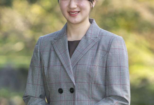 Princess Aiko strolls in the garden of the Imperial Residence: female members of the Japanese royal family continue to be expected to be “feminine, subservient and demure”. Photo: AP
