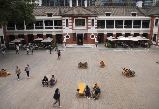 People take a rest at the Parade Ground at Tai Kwun, in Hong Kong’s Central district, on October 22. Photo: Winson Wong