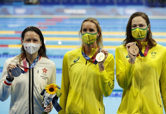 Siobhan Haughey, gold medallist Emma McKeon and bronze medallist Cate Campbell, both of Australia, at the 100m freestyle medal ceremony at the 2020 Tokyo Olympic Games. Photo: EPA 