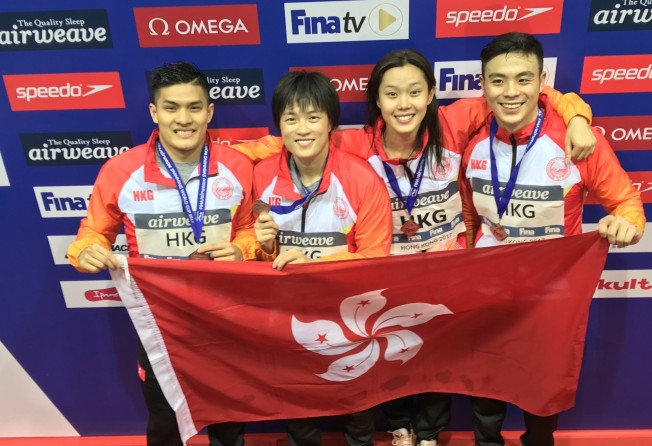 (From left) Hong Kong swimmers Kenneth To, Sze Hang-yu, Stephanie Au and Kent Cheung celebrate their silver in the 4x50m mixed freestyle relay at the 2017 FINA/airweave World Cup at Victoria Park. Photo: Chan Kin-wa