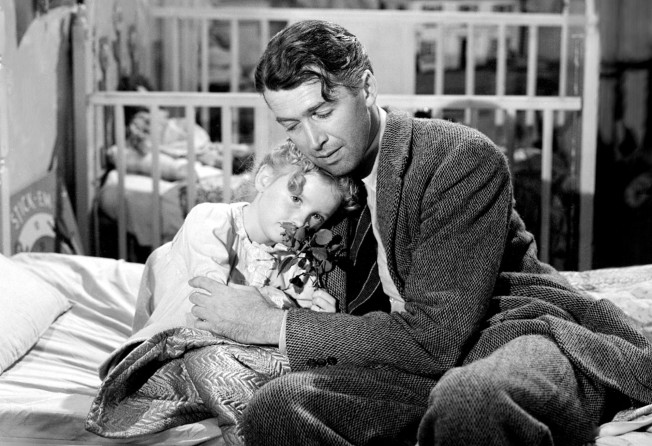 American actors James Stewart, as George Bailey, and Karolyn Grimes as his daughter Zuzu, in a scene from It’s a Wonderful Life, directed by Frank Capra, from 1946. Photo: Silver Screen Collection/Getty Images