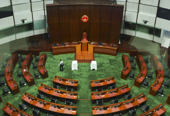 The Chinese national emblem is seen on the wall as it replaces the Hong Kong emblem at the Legislative chamber, before the Legislative Council election. Photo: SCMP/ Dickson Lee