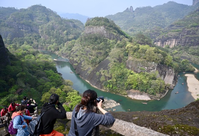 Tourists take photos at Wuyishan National Park in southeast China’s Fujian province in March 2021. Photo: Xinhua