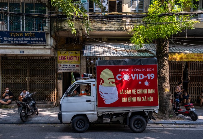 Weekend getaways to places like Hanoi in Vietnam – where, above, a police truck circulates to encourage precautions against Covid-19 – remain a distant prospect for would-be travellers in Asia. Photo: Linh Pham/Getty Images