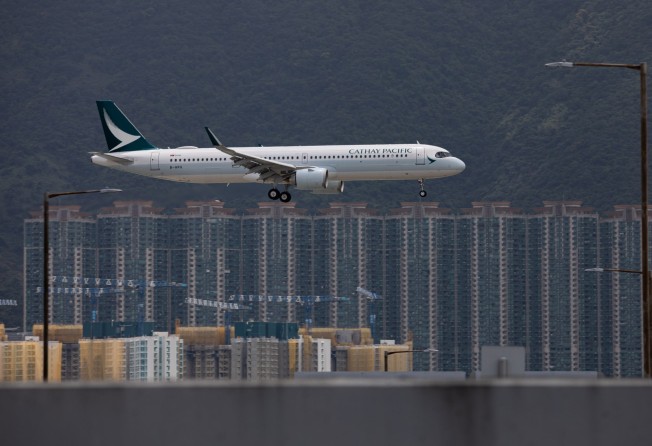 A Cathay Pacific Airways jet prepares to land in Hong Kong. As long as returning travellers need to quarantine for up to three weeks, overseas holidays will remain a distant dream for the city’s residents. Photo: EPA-EFE