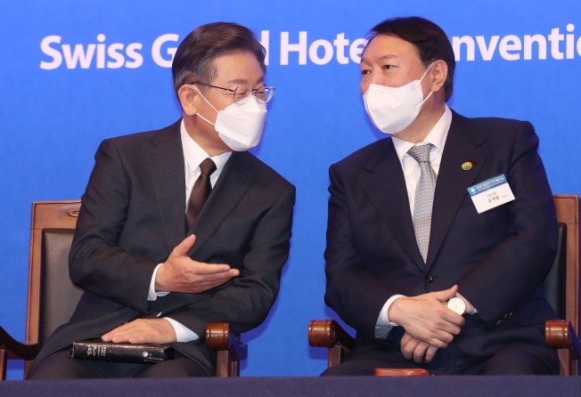 The latest polls indicate Yoon, right, is running neck-and-neck with rival Lee Jae-myung, left, the presidential candidate of the ruling Democratic Party. Photo: EPA/Yonhap
