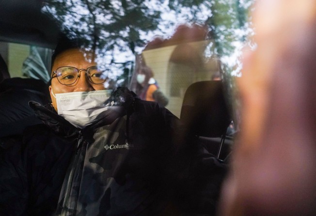 Ronson Chan, chairman of the Hong Kong Journalists Association, is taken away by national security police on Wednesday morning. Photo: Sam Tsang