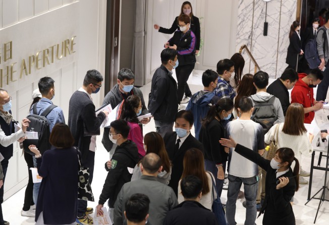 Potential homebuyers line up for The Aperture, built by Hang Lung Properties. Photo: May Tse