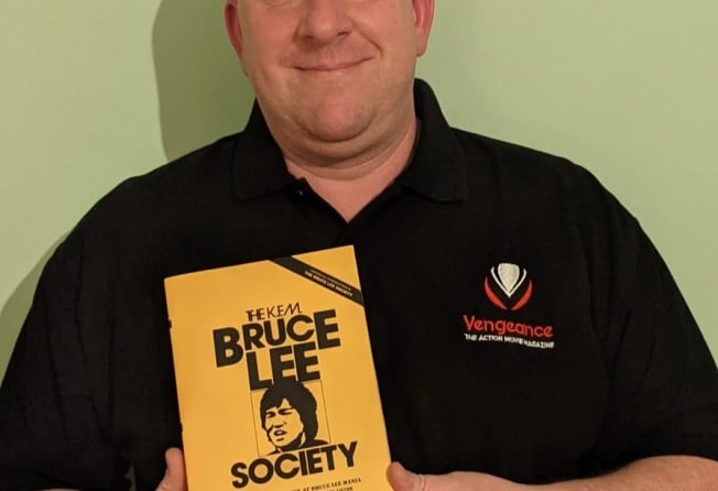 Author Carl Fox with his book The KFM Bruce Lee Society.