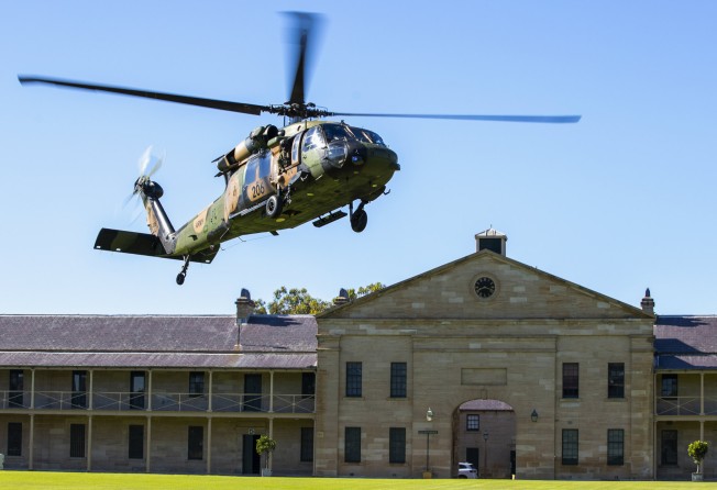 An Australian Army S-70A-9 Black Hawk helicopter lands at Victoria Barracks in Sydney. Photo: Department of Defence via AP 