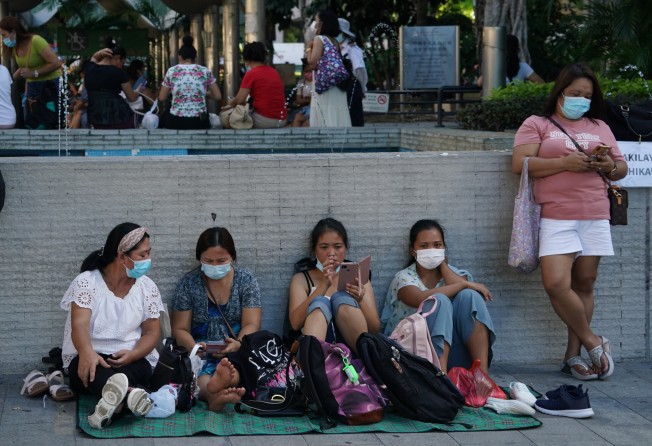 Foreign domestic helpers in Central on their day off. Photo: Felix Wong