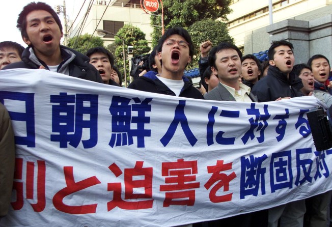 North Korean residents in Japan protest against discrimination outside the headquarters of the General Association of Korean Residents in Japan, or Chongryon, in Tokyo. Photo: AP