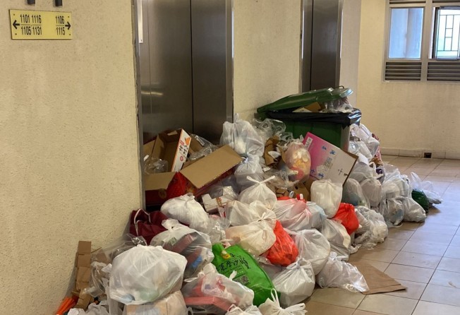 Garbage piles up at in the lift lobby of Yat Kwai House. Photo: SCMP