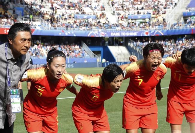 China’s national head coach Jia Xiuquan and players Wu Haiyan, Han Peng, Wang Shuang and Wang Shanshan share encouragement before their round of 16 qualifying match against Italy at the 2019 Fifa Women’s World Cup in Montpellier, France. Photo: Xinhua