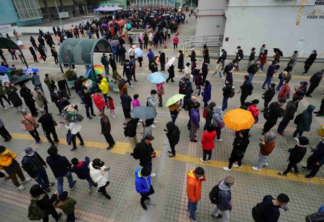 Long lines form as residents wait at a mobile testing station in Hong Kong. Photo: Felix Wong