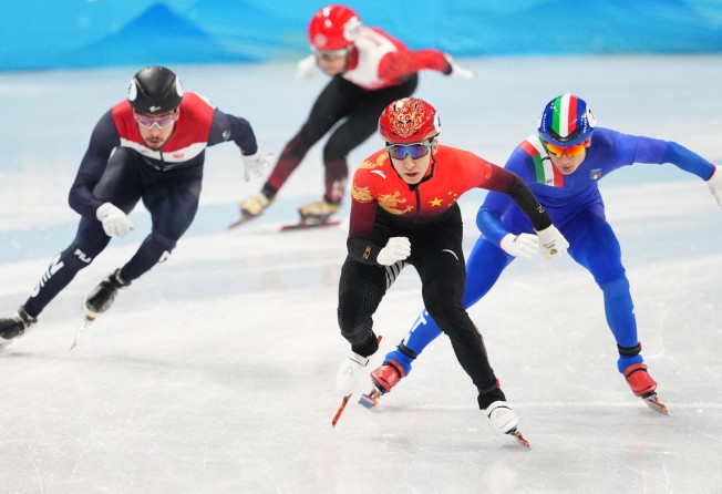 Sidney Chu (second from left) of Hong Kong with Wu Dajing (centre) of China in the Beijing Winter Olympic Games men’s 500m short-track speedskating event in the Capital Indoor Stadium. Photo: Reuters