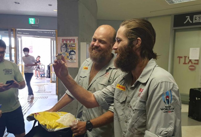 Ron Rutland and James Owen arrive in Osaka, as they cycle to the Rugby World Cup. There will now be a commemorative whistle for both the men’s and the women’s Rugby World Cups because of Rutland’s adventures. Photo: DHL Race to Rugby World Cup