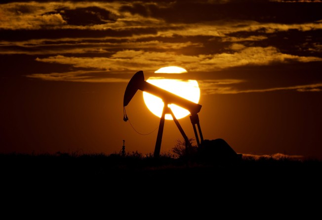 The sun sets behind a pump jack near Karnes City, USA. The International Energy Agency (IEA) said its member countries, including the US and Japan, agreed to release 60 million barrels of oil from their emergency reserves to ensure stability for oil markets amid Russia’s invasion of Ukraine. Photo: AP