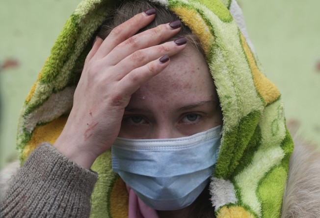 A woman outside the bombed maternity hospital. Photo: AP