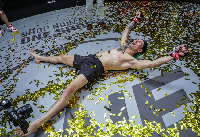 Thanh Le celebrates after knocking out Garry Tonon to retain his featherweight title at ONE: Lights Out.