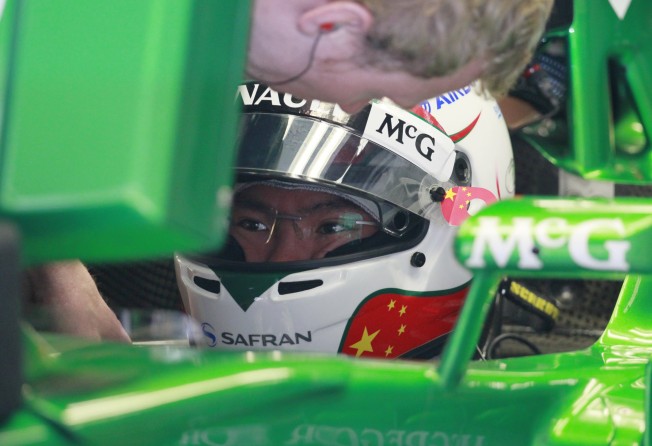 Caterham Formula One reserve driver Ma Qinghua gets ready for the first practice session at the Chinese Grand Prix in Shanghai in 2013. Photo: AP
