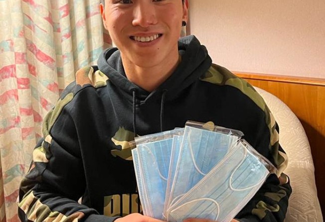 Hong Kong vault gymnast Stone Shek Wai-hung donates thousands of anti-Covid-19 supplies for the New World Development’s “Share For Good” campaign. Photo: Handout
