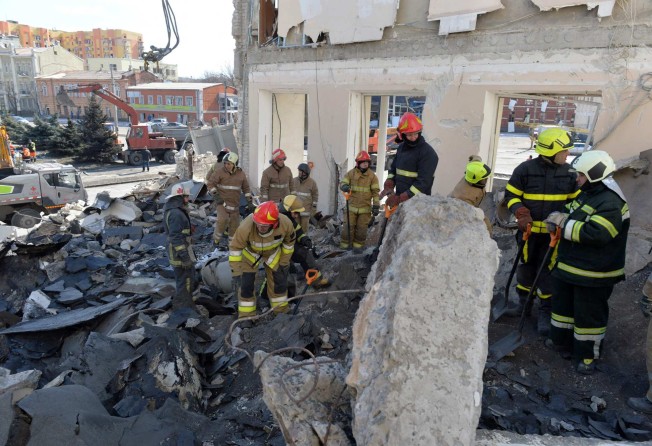 Rescuers clear the rubble of a building damaged by shelling in Kharkiv last week amid Russia’s brutal invasion of Ukraine. Photo: AFP