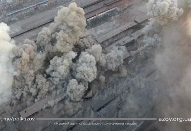 Smoke rises around an industrial compound after multiple explosions amid the Russian invasion of Ukraine, in Mariupol, in this screengrab from a video released Tuesday. Photo: via Reuters