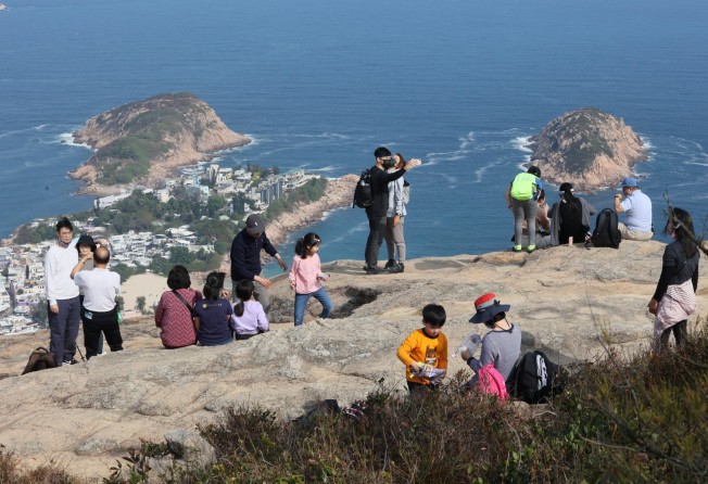 Hikers enjoy the sunny weather on the Dragon’s Back trail in Shek O. Photo: SCMP / Dickson Lee