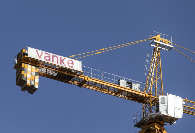 A crane with the China Vanke’s logo at a residential construction site in the Nanchuan area of Xining, Qinghai province on September 28, 2021. Photo: Bloomberg