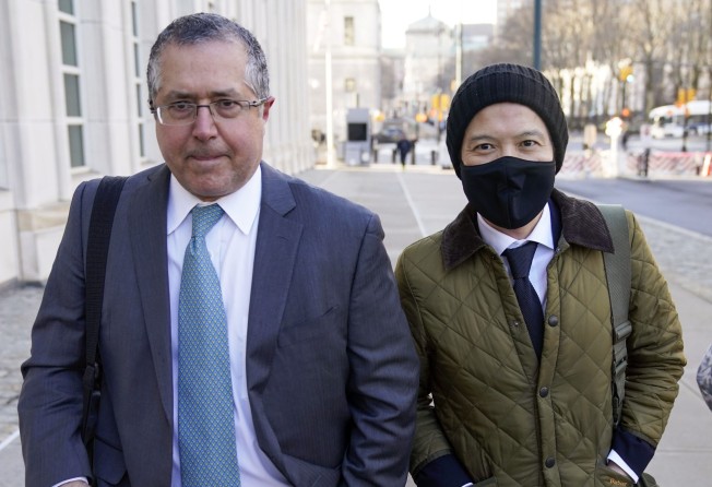 Roger Ng, right, with his defence lawyer Marc Agnifilo. File photo: AP