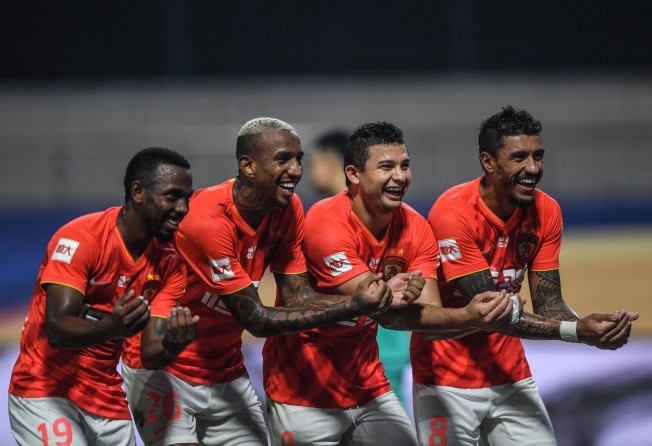(From left) Fernando Fei Nanduo, Anderson Talisca, Elkesen and Paulinho celebrate for Guangzhou FC against Shanghai Shenhua in the Chinese Super League. Photo: Xinhua