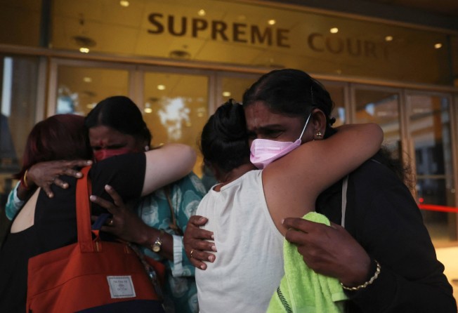Panchalai Supermaniam, right, mother of Malaysian national Nagaenthran K. Dharmalingam, weeps as she thanks supporters after her last-ditch legal challenge against her son’s execution was dismissed on Tuesday. Photo: Reuters