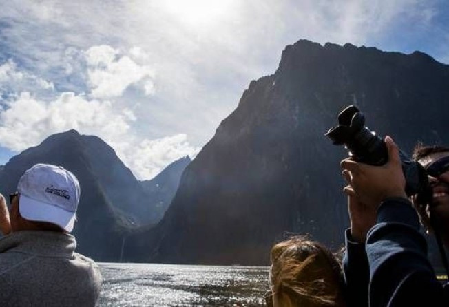 Milford Sound in New Zealand’s South Island received more than 800,000 visitors in 2018. New Zealand is considering charging foreigners to visit unique areas. Photo: Mike Scott/New Zealand Herald