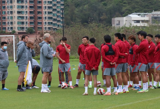 Hong Kong head coach Jorn Andersen (third from left) addresses his players at training in Hong Kong. Photo: Chan Kin-wa