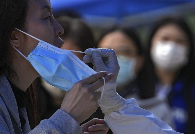 A woman receiving a Covid-19 test. The pandemic has not been the only source of anxiety. Hong Kong saw months of civil unrest in 2019 and the introduction of a new security law in 2020. Photo: AP