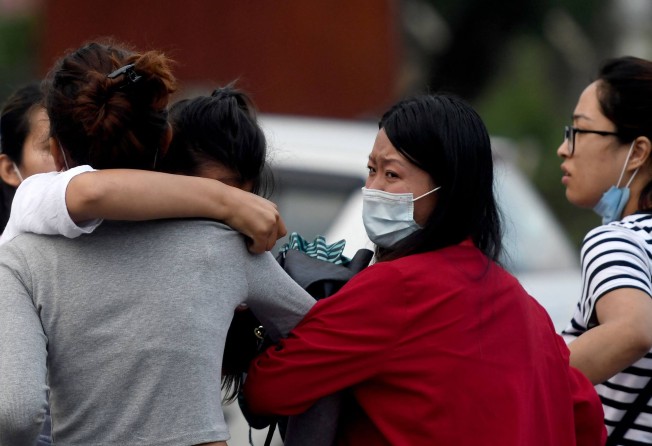 Relatives of passengers on board the missing aircraft, outside the airport in Pokhara. Photo: AFP